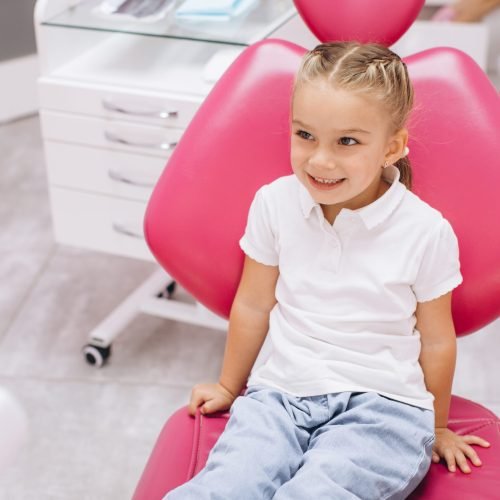 Little girl smiling on a visit to the dentist at the dental clinic